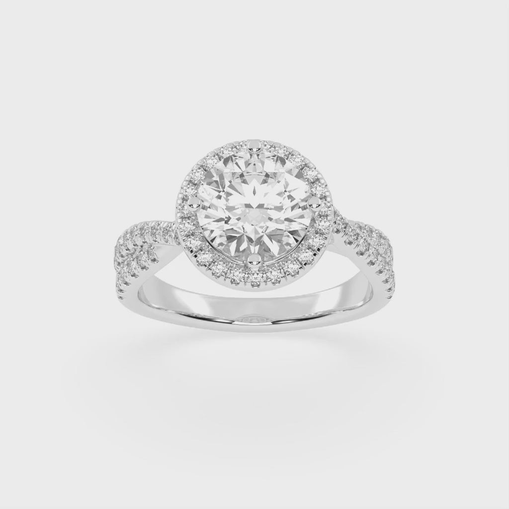 Anillo de compromiso con diamantes cultivados en laboratorio de talla redonda y halo con engaste pavé retorcido